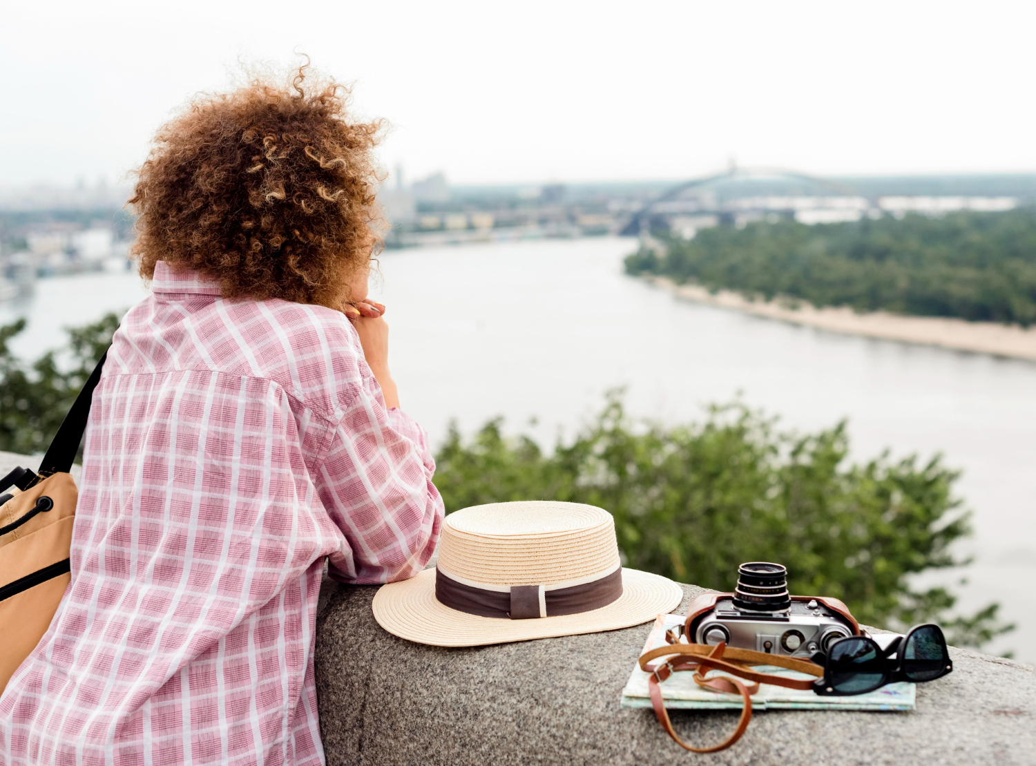 A young lady overlooking a view