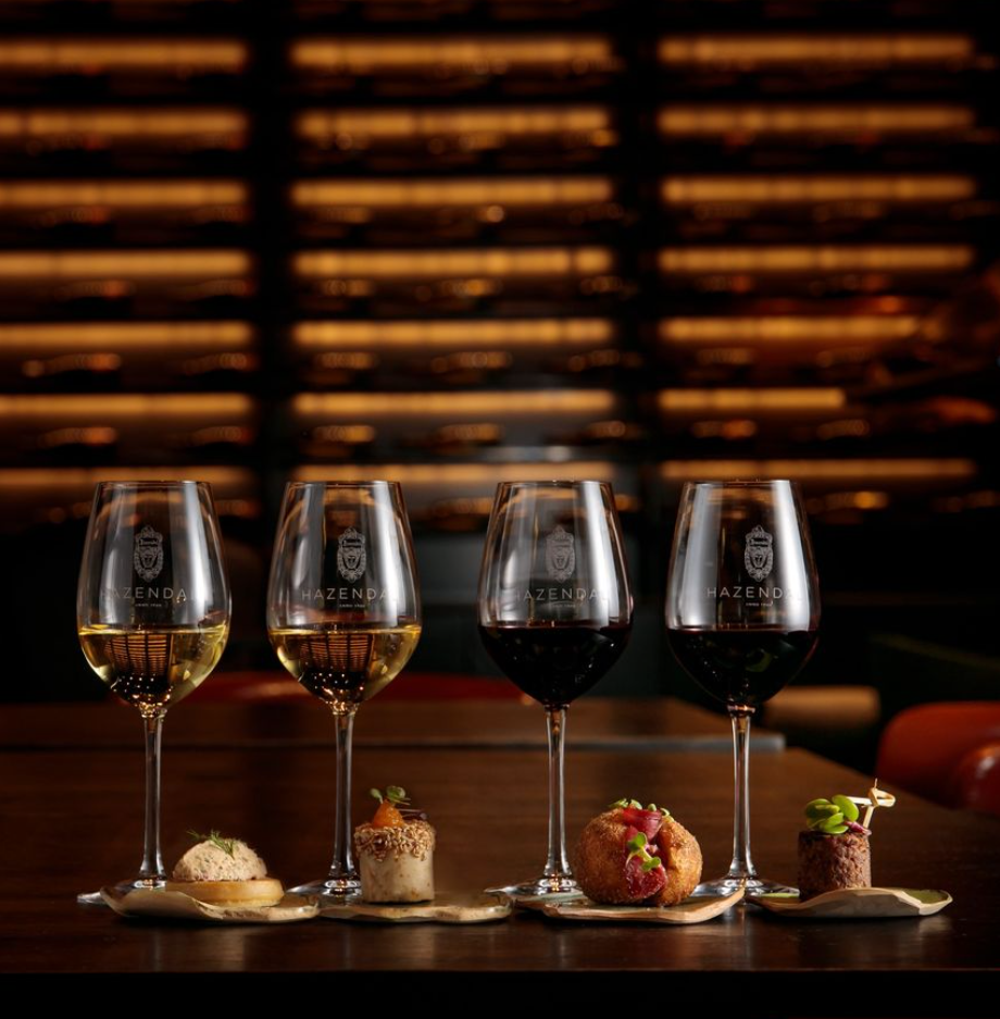 Four glasses filled with wine