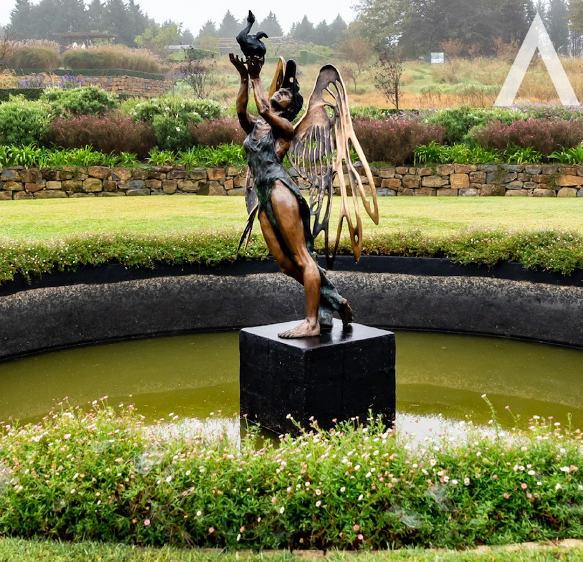 A statue in a water fountain