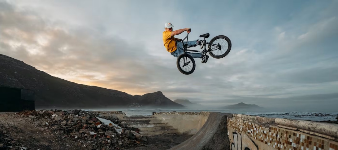 A cyclist driving his bicycle on a skate track